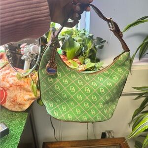 Dooney and Bourke bucket bag. Green with pink detail and brown handle